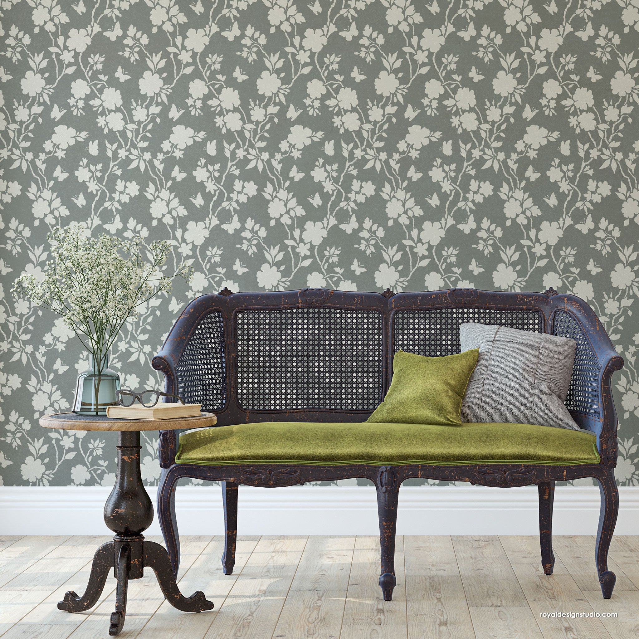 Vintage-style bench against a floral chinoiserie hand painted wallpaper pattern wall.