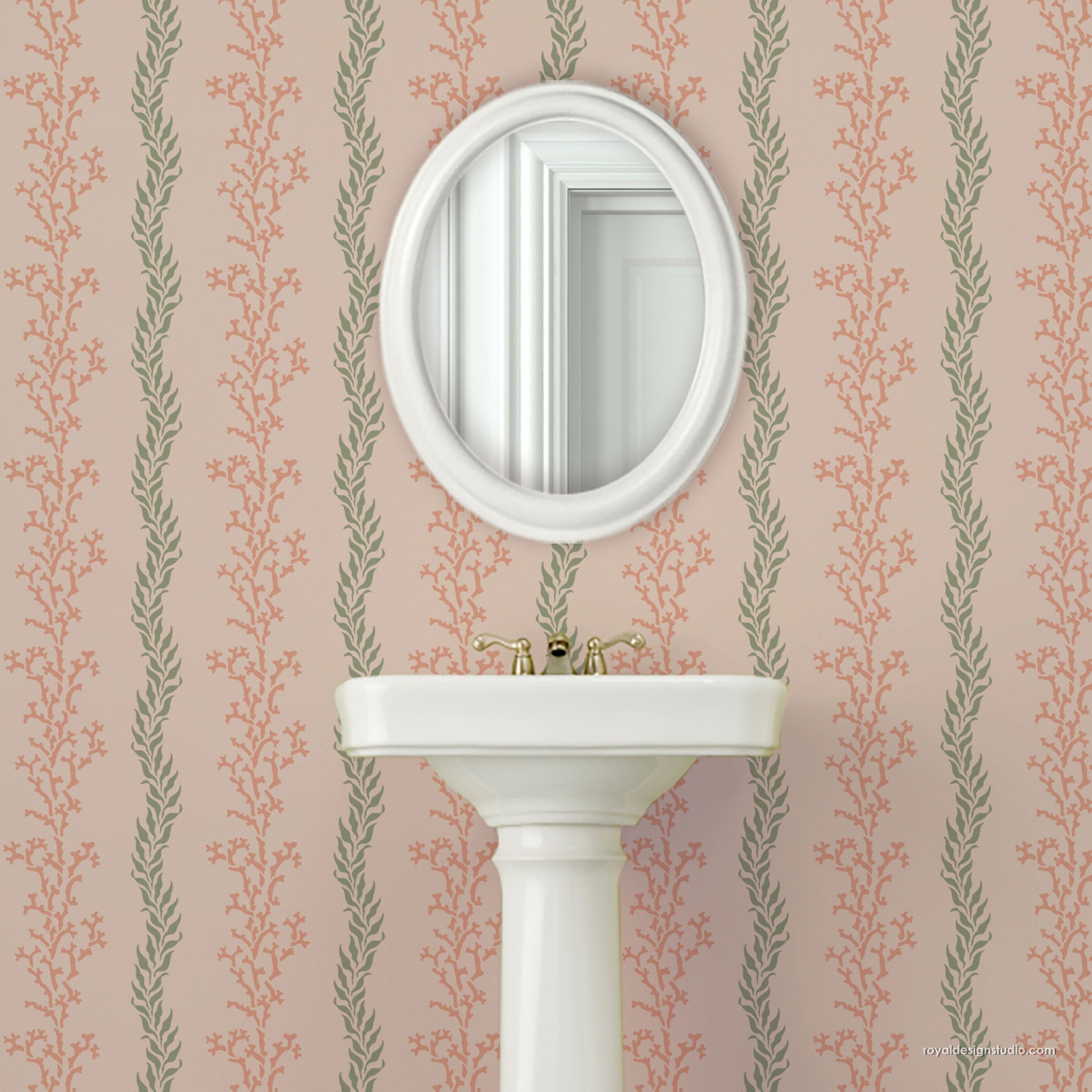 Wall stencil pattern in coastal style with White pedestal sink with round mirror