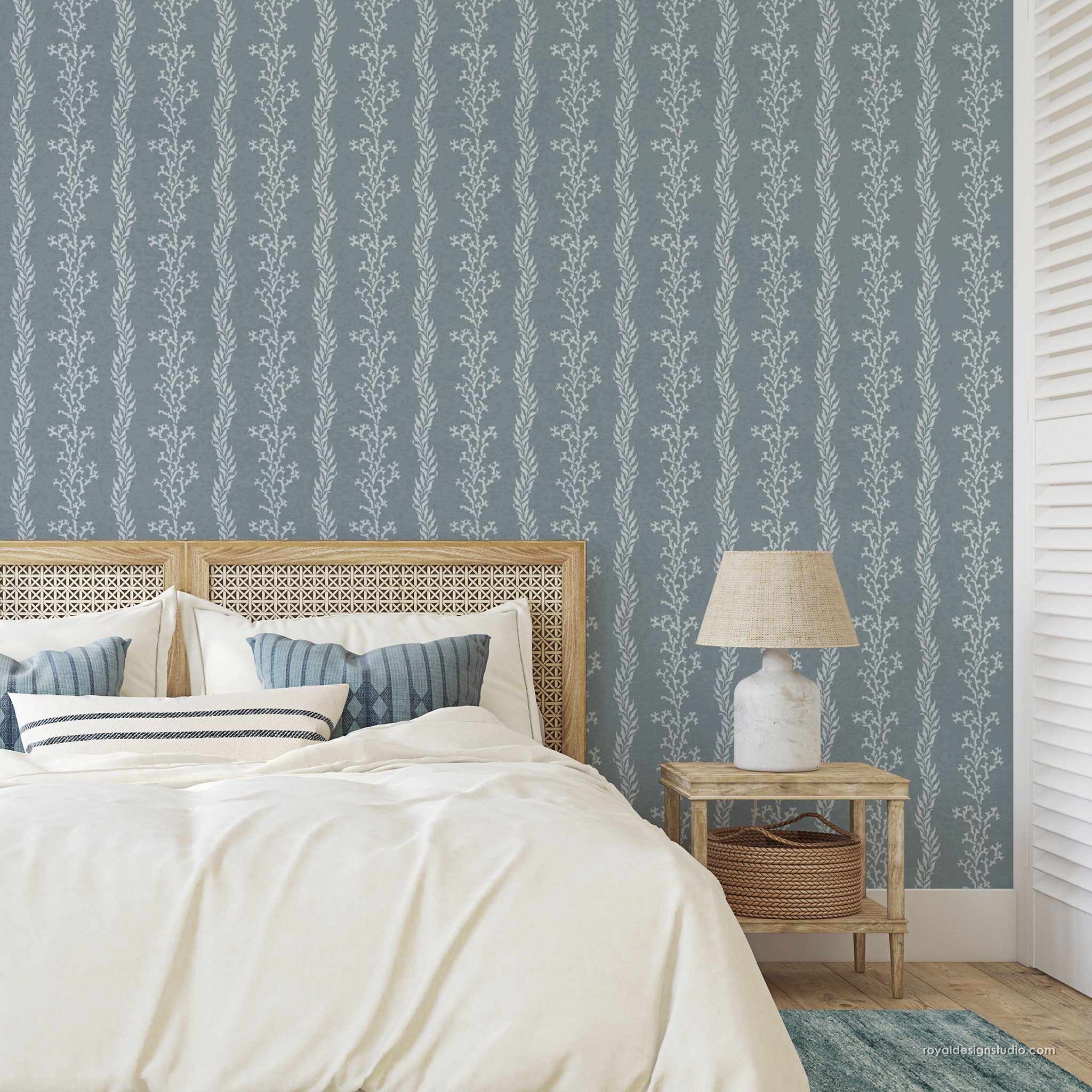 Coastal cottage look bedroom with coral stripe wall stencil pattern