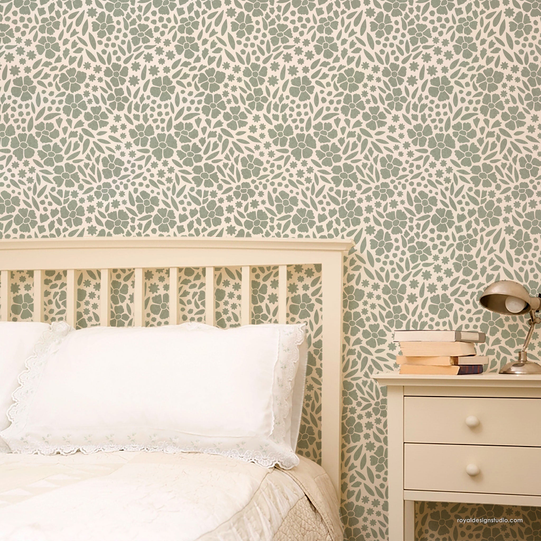 Bedroom with floral ditsy wall stencili painted like wallpaper, bed, and nightstand.