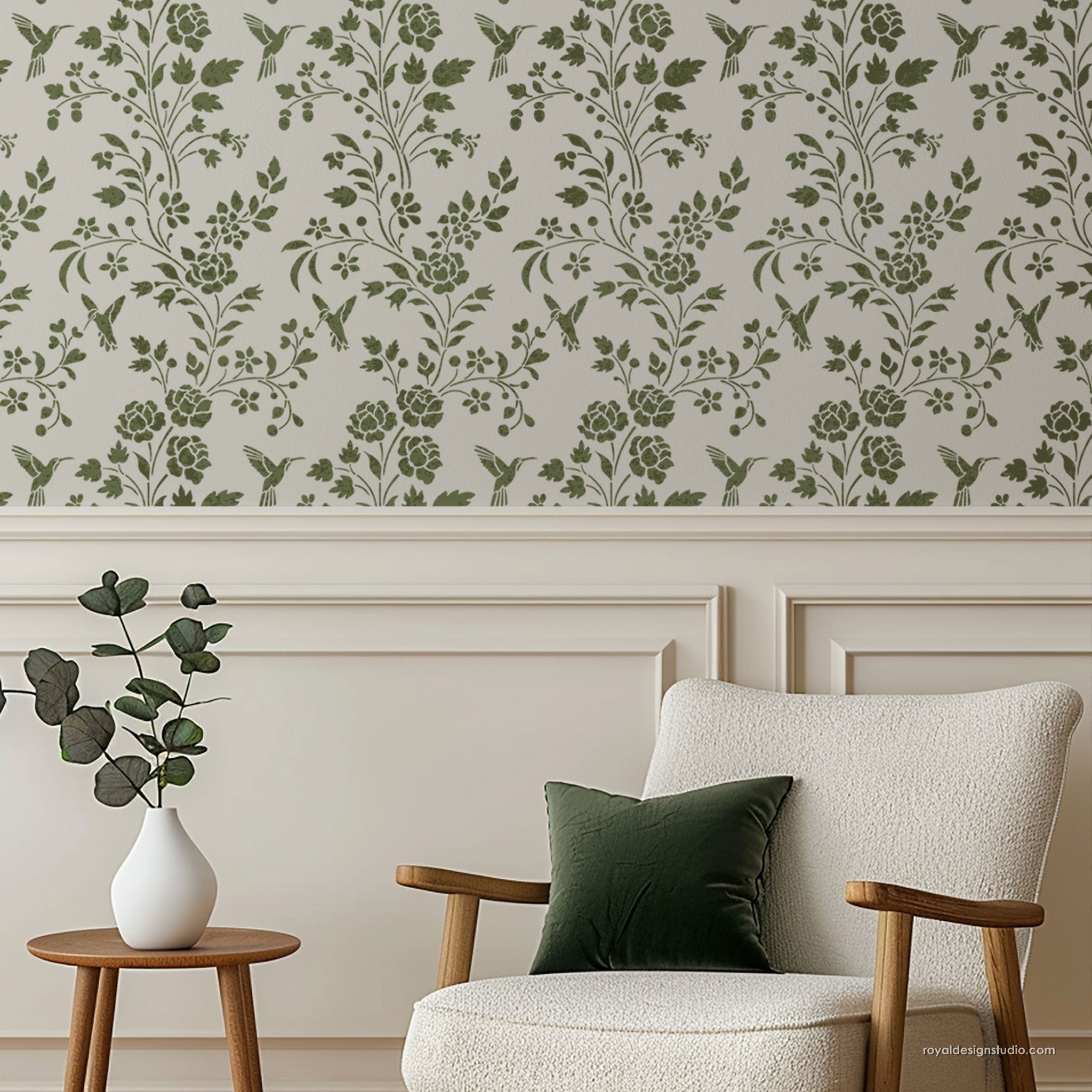 Living room with floral Chinoiserie wallpaper stencil pattern, white armchair, and wooden side table.