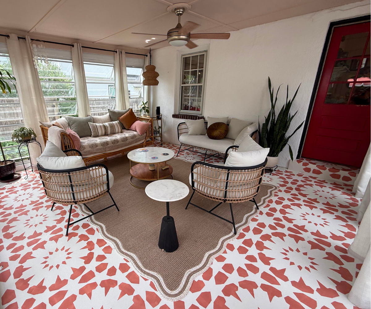 Large scale tile stencil on concrete floor in orange Moroccan design