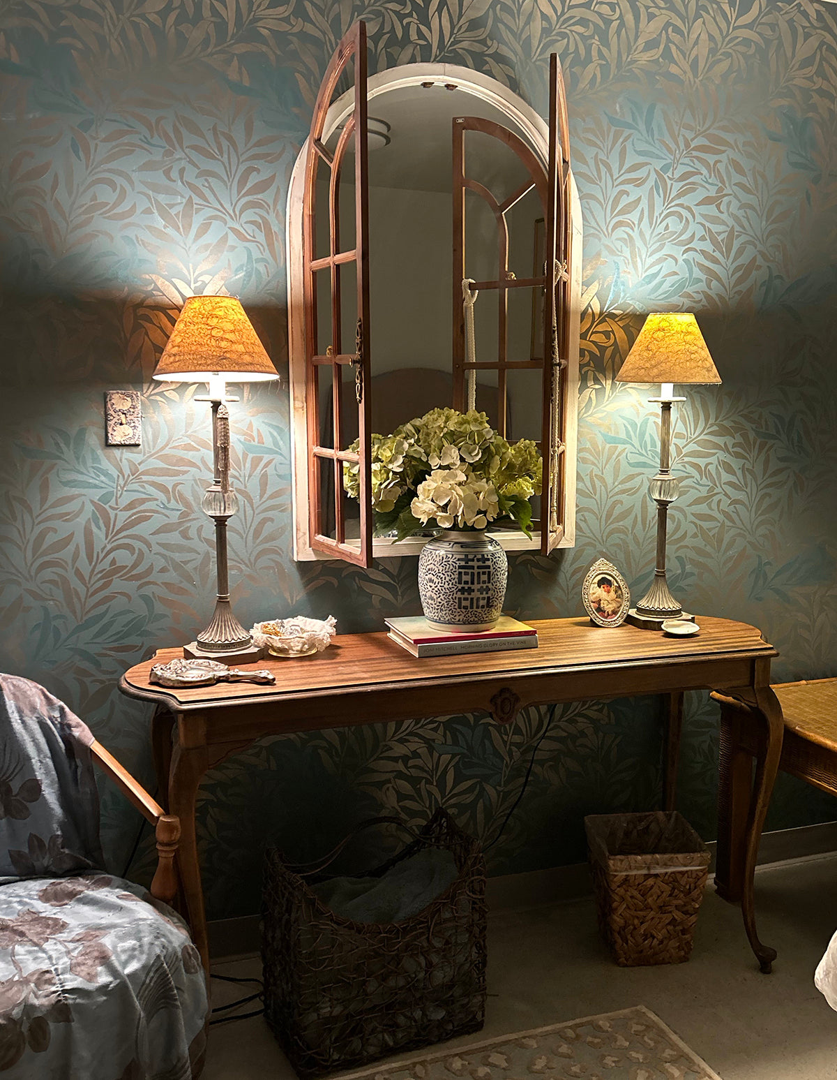 stenciled leaf pattern on a blue bathroom wall