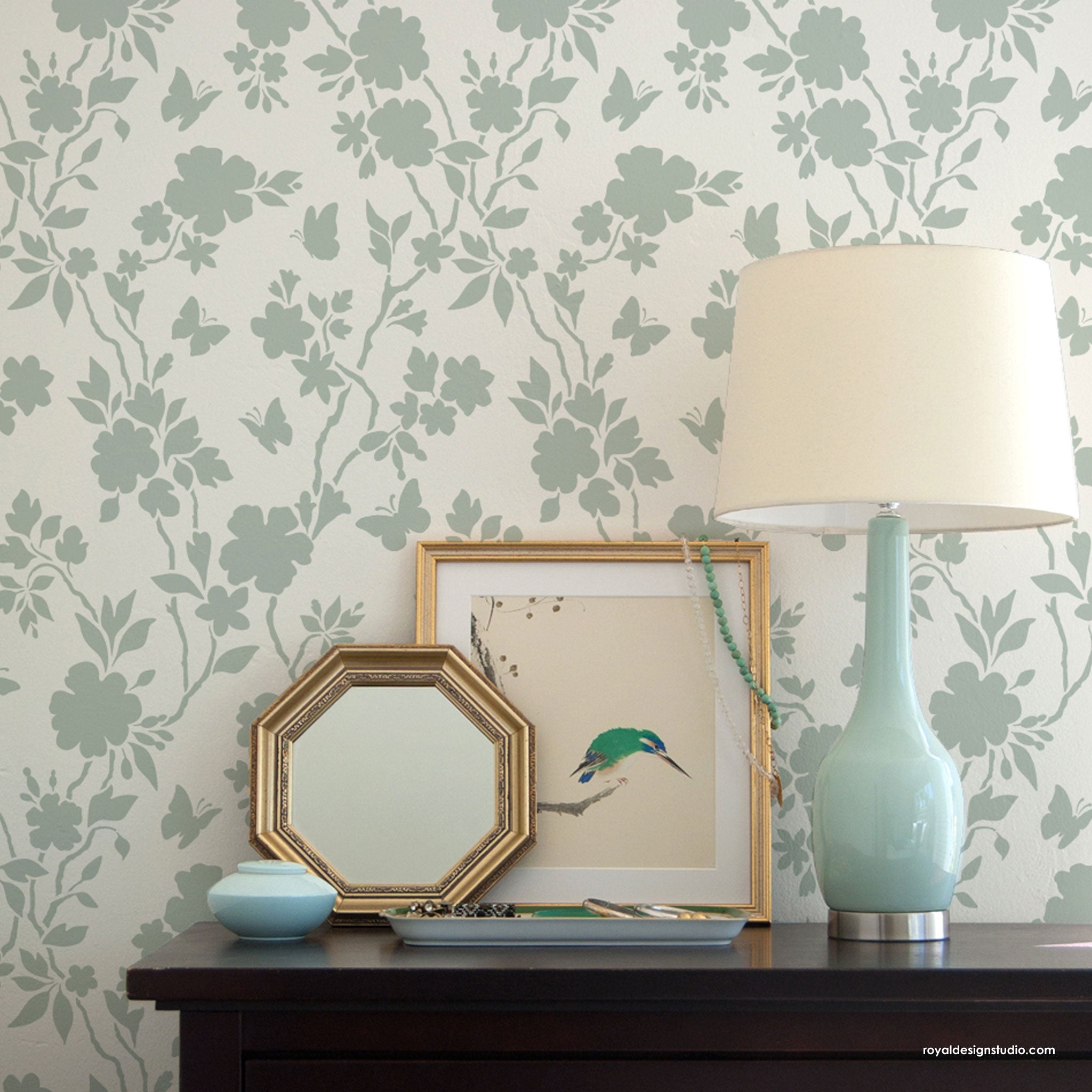 Floral wall stencil on a bedroom wall in chinoiserie style