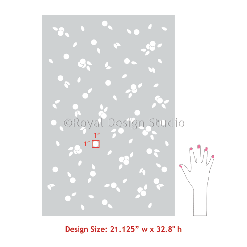 A stencil design preview showing a rectangular gray sheet with a scattered white floral and leaf pattern, a small red 1-inch scale marker, a hand outline with pink nail tips, and text reading 'Design Size: 21.125" w x 32.
