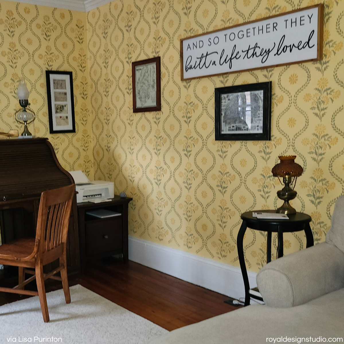 A styled interior room corner with a yellow stenciled wall pattern painted using a cottage style stencil