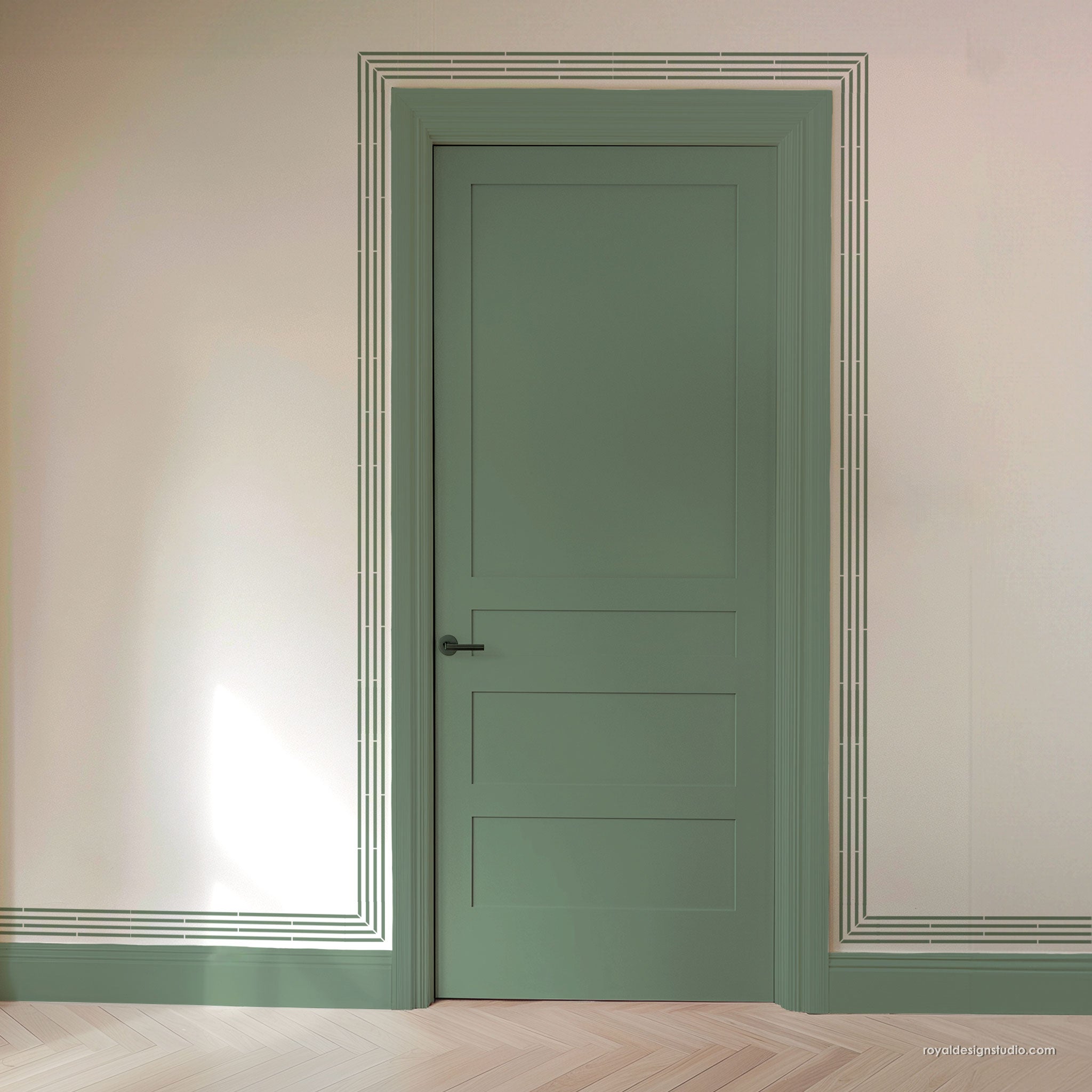 A sage green paneled interior door with a black metal handle, set within a matching green door frame and bordered by decorative white lines on a beige wall with light wood herringbone flooring.