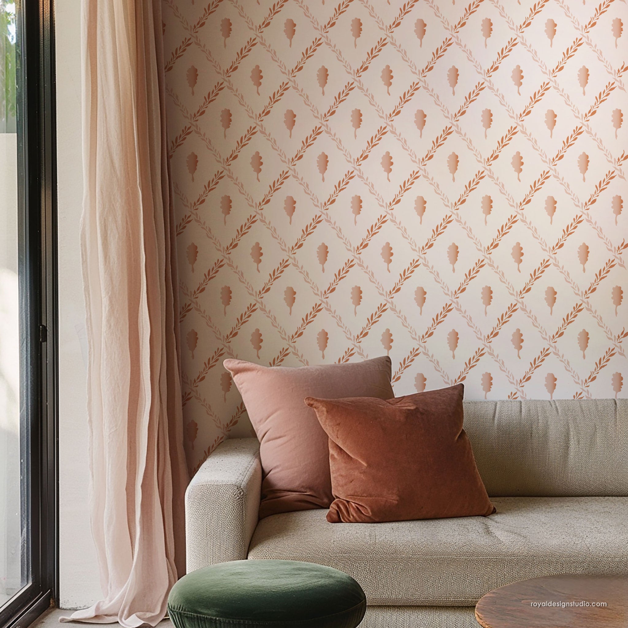Living room with trellis wall stencil painted like patterned wallpaper, sofa, and decorative pillows.