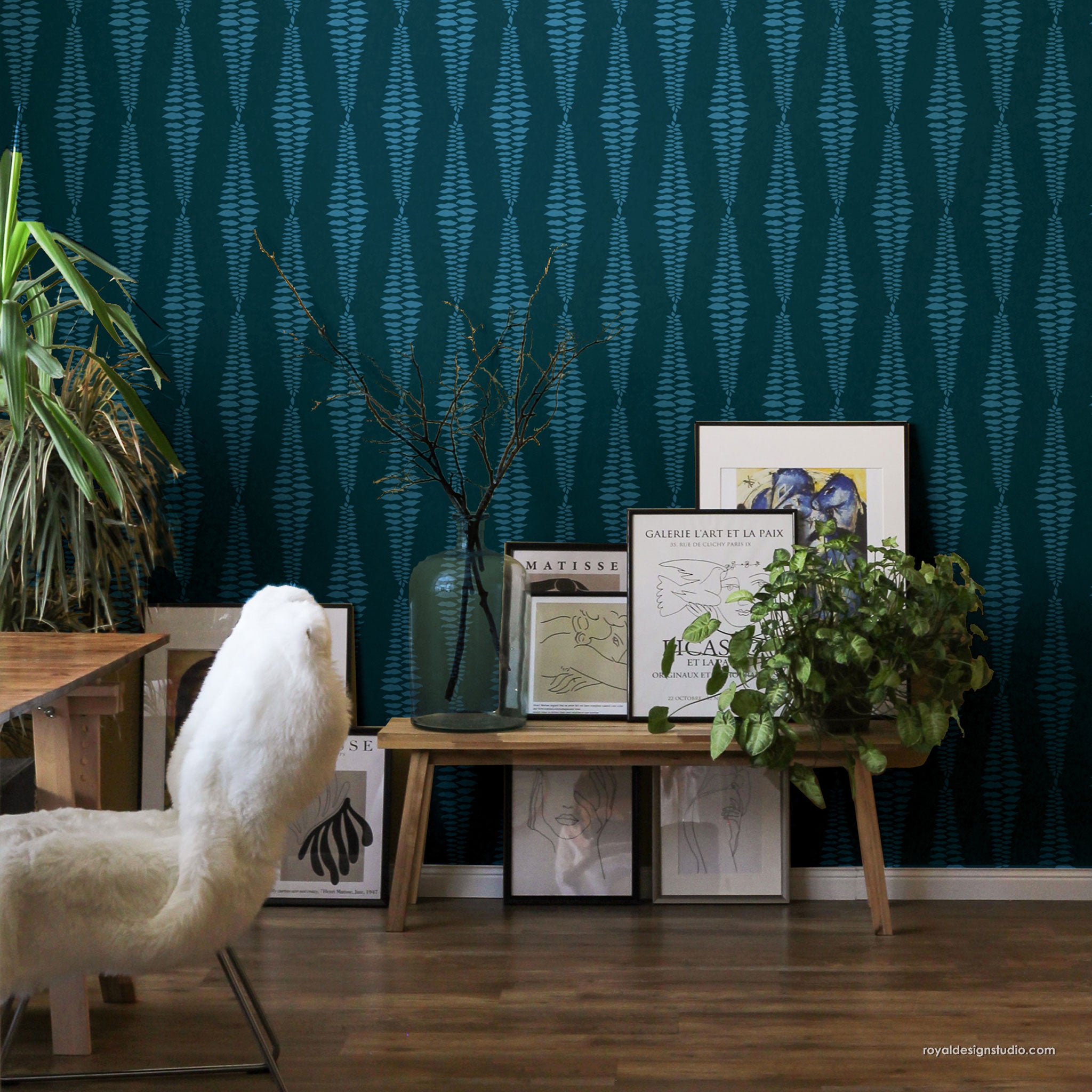 Living room with tribal patterned wall stencil wooden furniture, and decorative items.