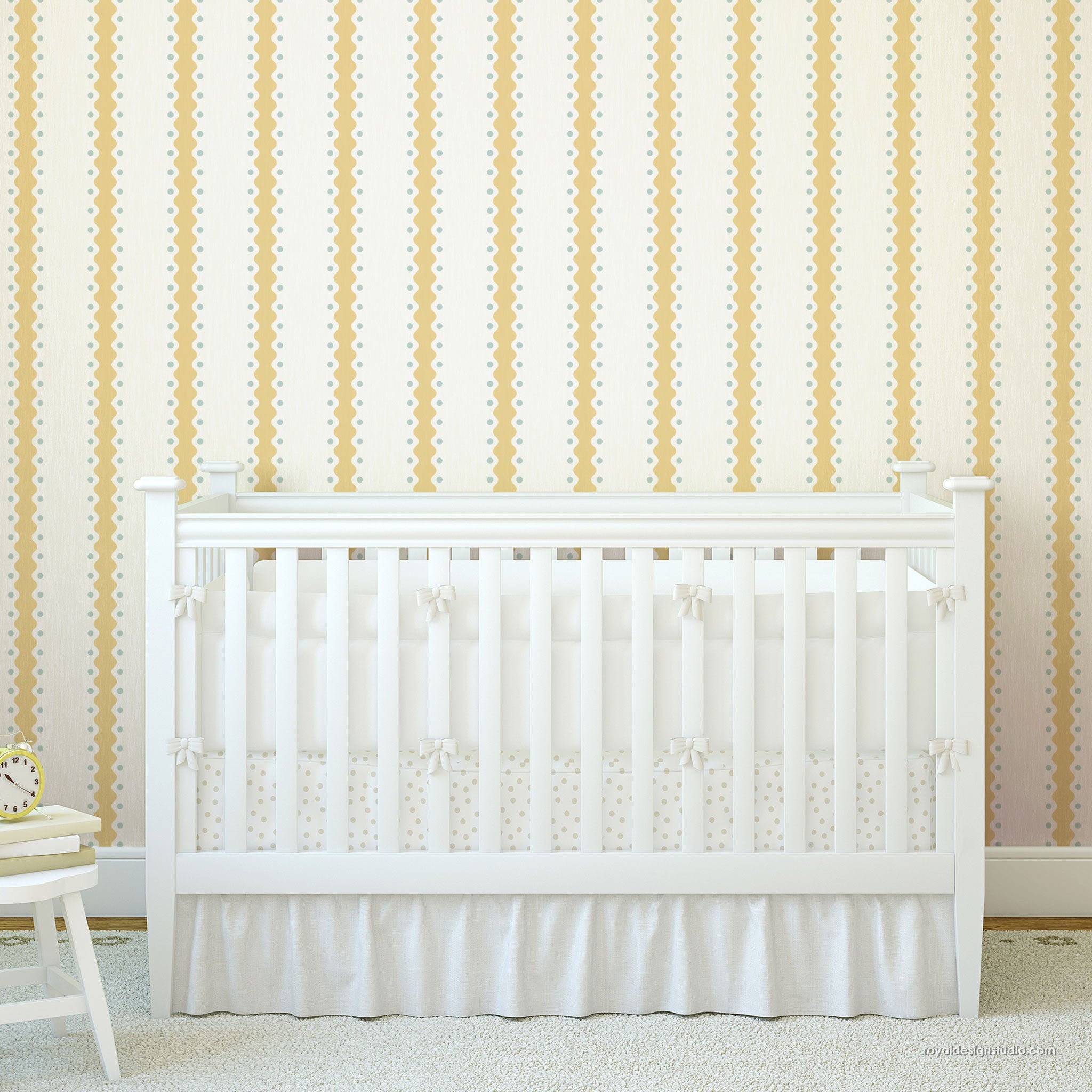 A white wooden crib with a white ruffled skirt and matching crib sheet, set against a cream wall with vertical yellow and white dotted stripes.
